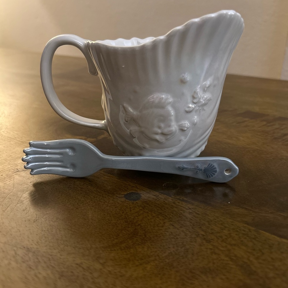 This is a Disney Parks The Little Mermaid 35th Anniversary Mug, with fork/spoon.
